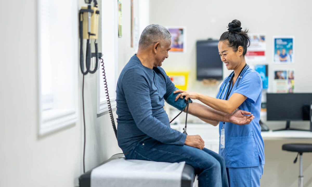 Nurse taking patients blood pressure